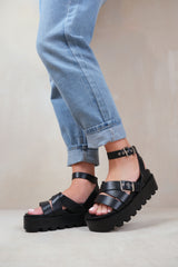 LAYLA WIDE FIT BUCKLE STRAP PLATFORM SANDALS IN BLACK FAUX LEATHER