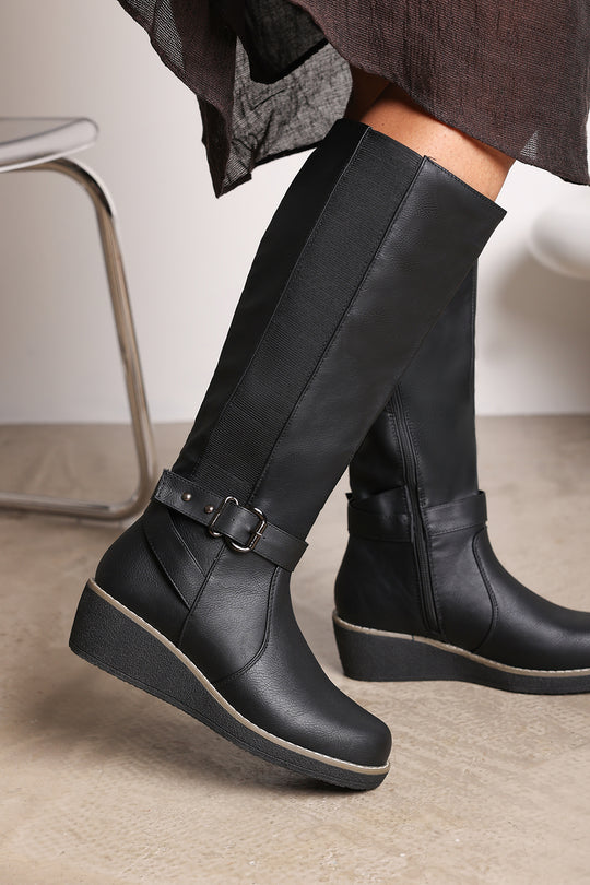 Oriana Black Faux Leather Knee High Wedge Boots With Strap And Buckle