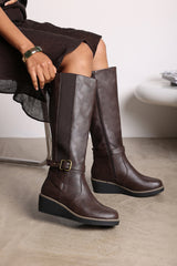Oriana Wide Fit Brown Faux Leather Knee High Wedge Boots With Strap And Buckle