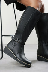 Jaxelle Black Knee High Wedge Heel Boots with Buckle Strap