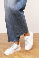 Eliane White Low Wedge Trainer with Silver Lace up detail