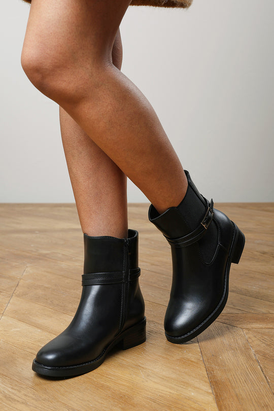 Haxine Black Chelsea Flat Ankle Boot With Gold Buckle Detail