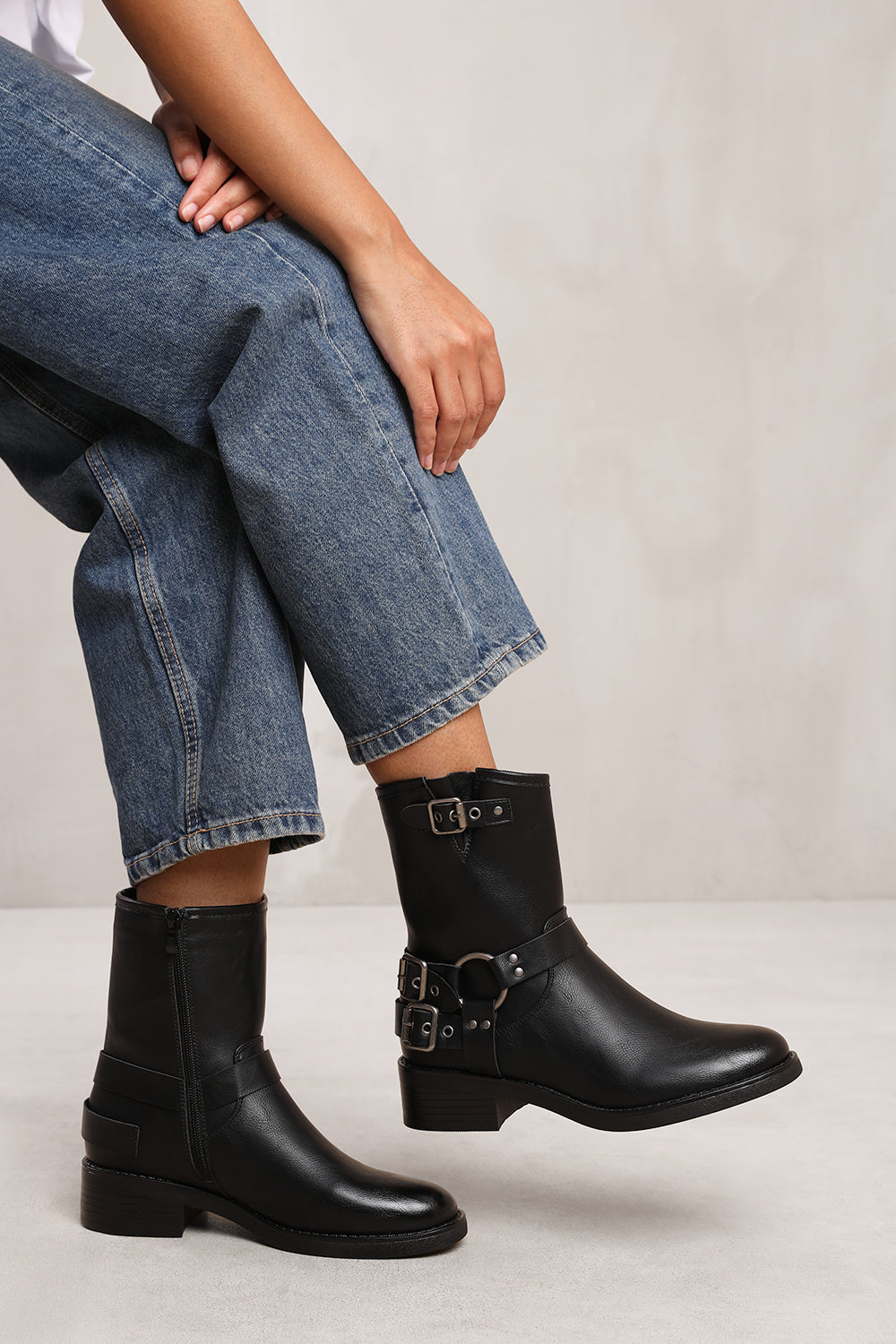 BODE ANKLE BOOT WITH BUCKLE DETAILING IN BLACK FAUX LEATHER