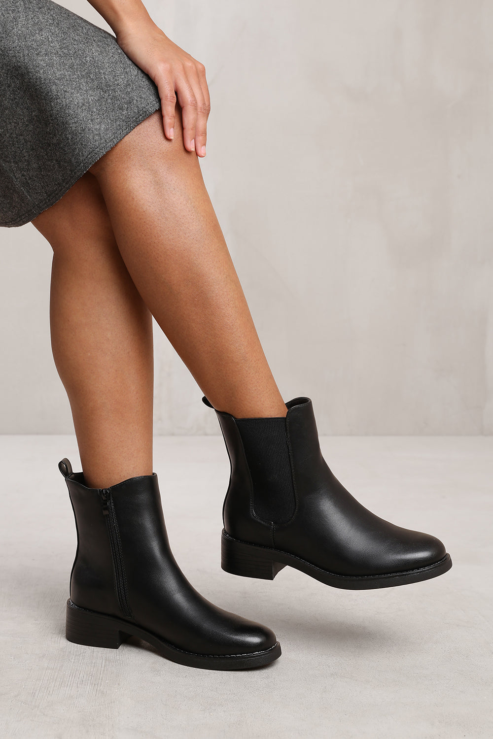 OLIVIA WIDE FIT ANKLE BOOT WITH ELASTIC PANEL AND SIDE ZIP IN BLACK FAUX LEATHER