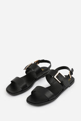 CAMILLA CLASSIC FLAT SANDALS WITH STRAP AND BUCKLE DETAIL IN BLACK FAUX LEATHER