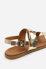 CAMILLA WIDE FIT CLASSIC FLAT SANDALS WITH STRAP AND BUCKLE DETAIL IN GOLD METALLIC FAUX LEATHER