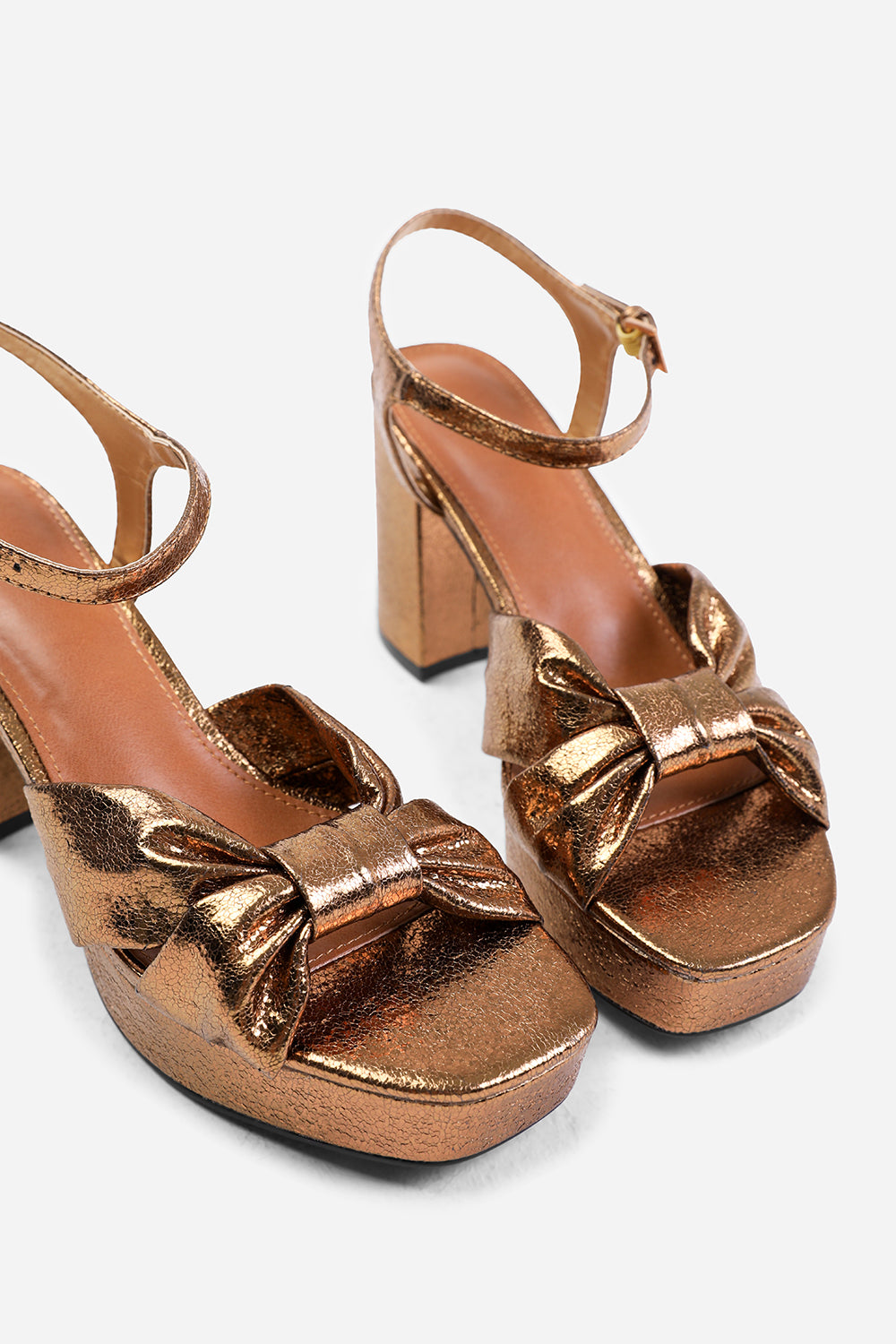 TALIA MID BLOCK HEEL WITH PLAFTORM AND BOW DETAILING IN GOLD FAUX LEATHER