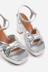 Karina Metallic Silver Platform Mid Heel Sandals with Bow Detail