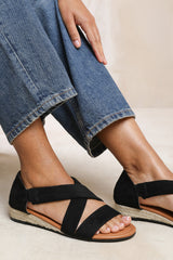 HUMMINGBIRD LOW WEDGE SHOES WITH CROSS OVER STRAP IN BLACK SUEDE