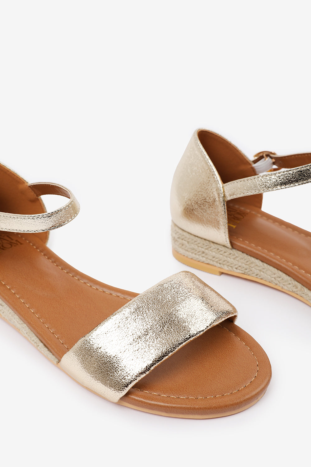 ELEANOR WIDE FIT LOW WEDGE SHOES WITH ADJUSTABLE ANKLE STRAP IN GOLD METALLIC FAUX LEATHER