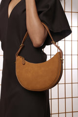 Pebble Modern Half Moon Shoulder Bag In Cognac