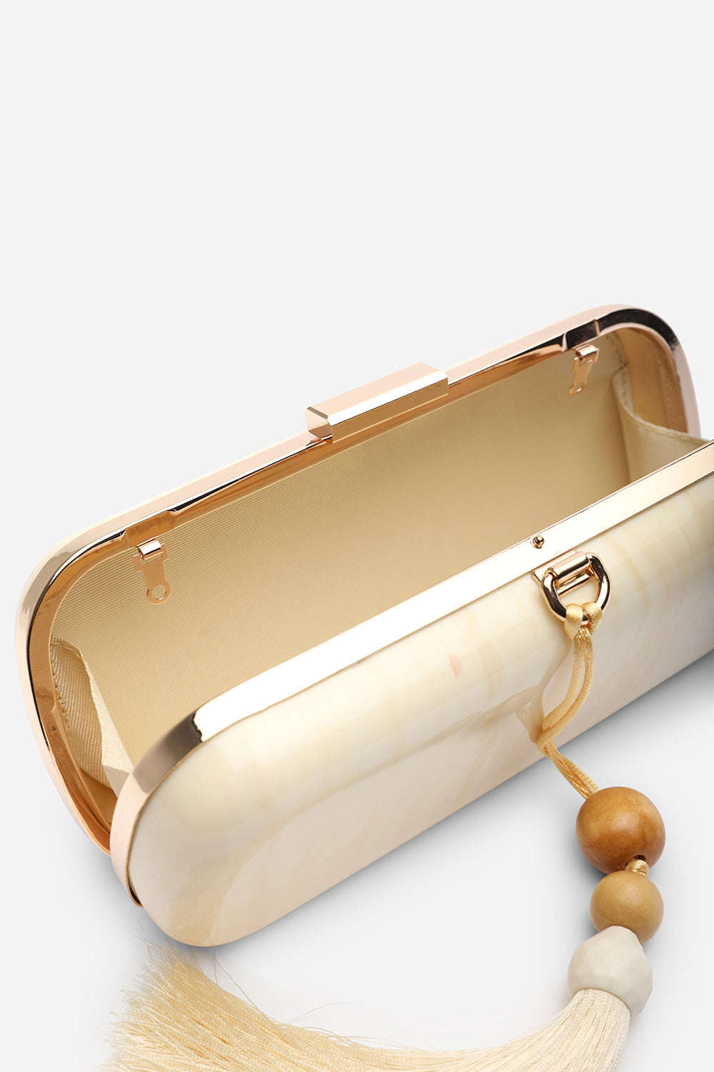 Falcon Marble Finish Tassel Clutch Bag In White Gold