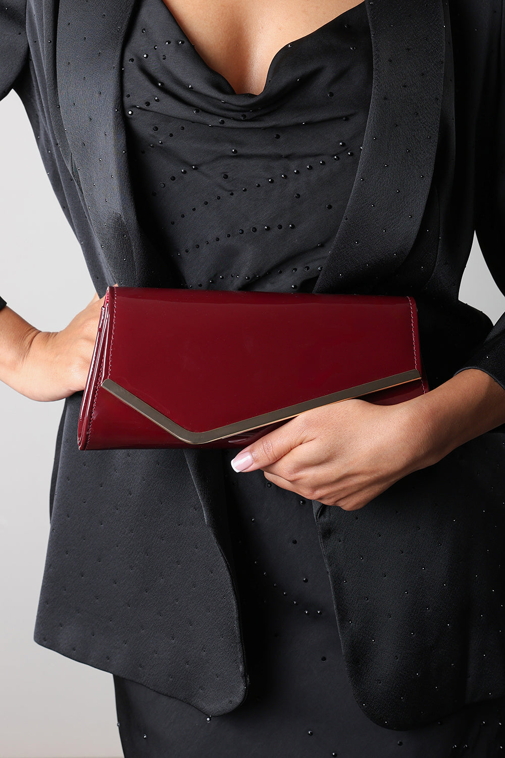 Hovena Burgundy Patent Asymmetric Envelope Clutch With Silver Trim