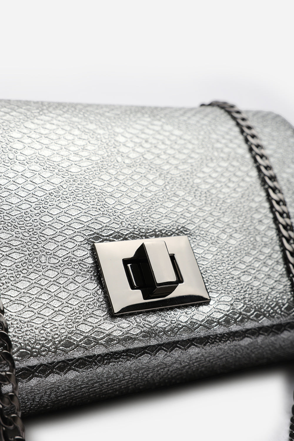 Lurexa Silver Metalic Snake Clutch & Crossbody Bag With Twist Lock Detail and Chain