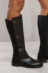 ARALYN BELOW KNEE BOOT WITH BUTTON DETAILING AND SIDE ZIP IN BLACK FAUX LEATHER