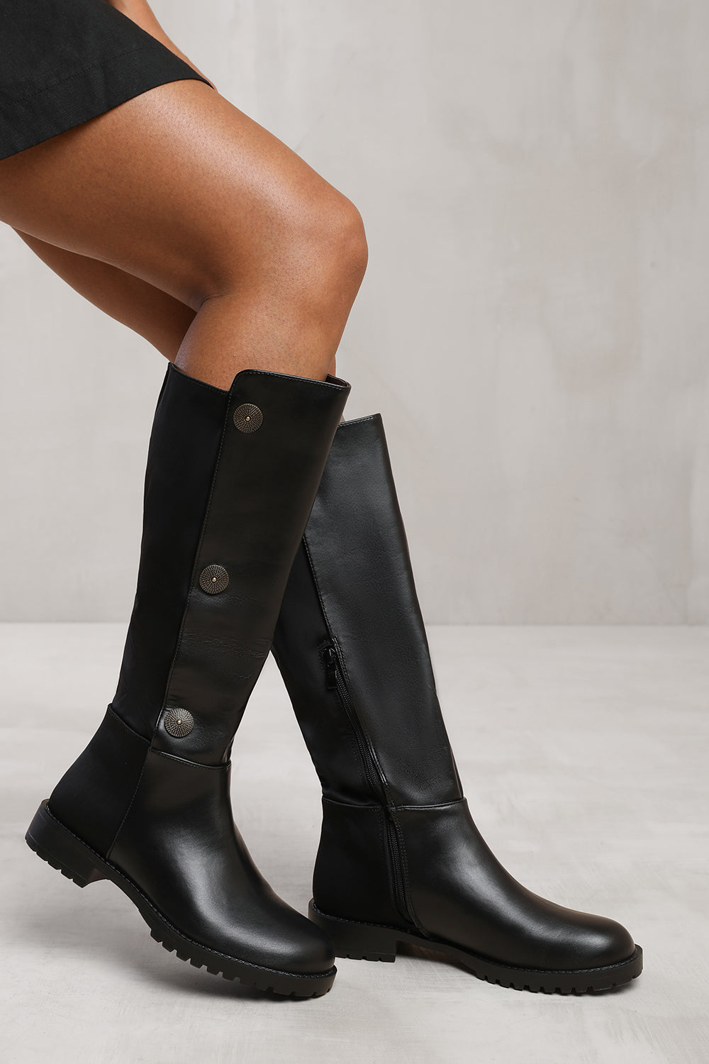 ARALYN BELOW KNEE BOOT WITH BUTTON DETAILING AND SIDE ZIP IN BLACK FAUX LEATHER