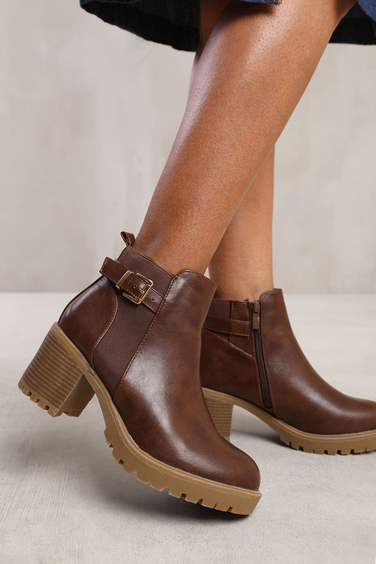 KALI MID BLOCK HEEL WITH BUCKLE DETAIL STRETCH ANKLE BOOTS IN BROWN FAUX LEATHER