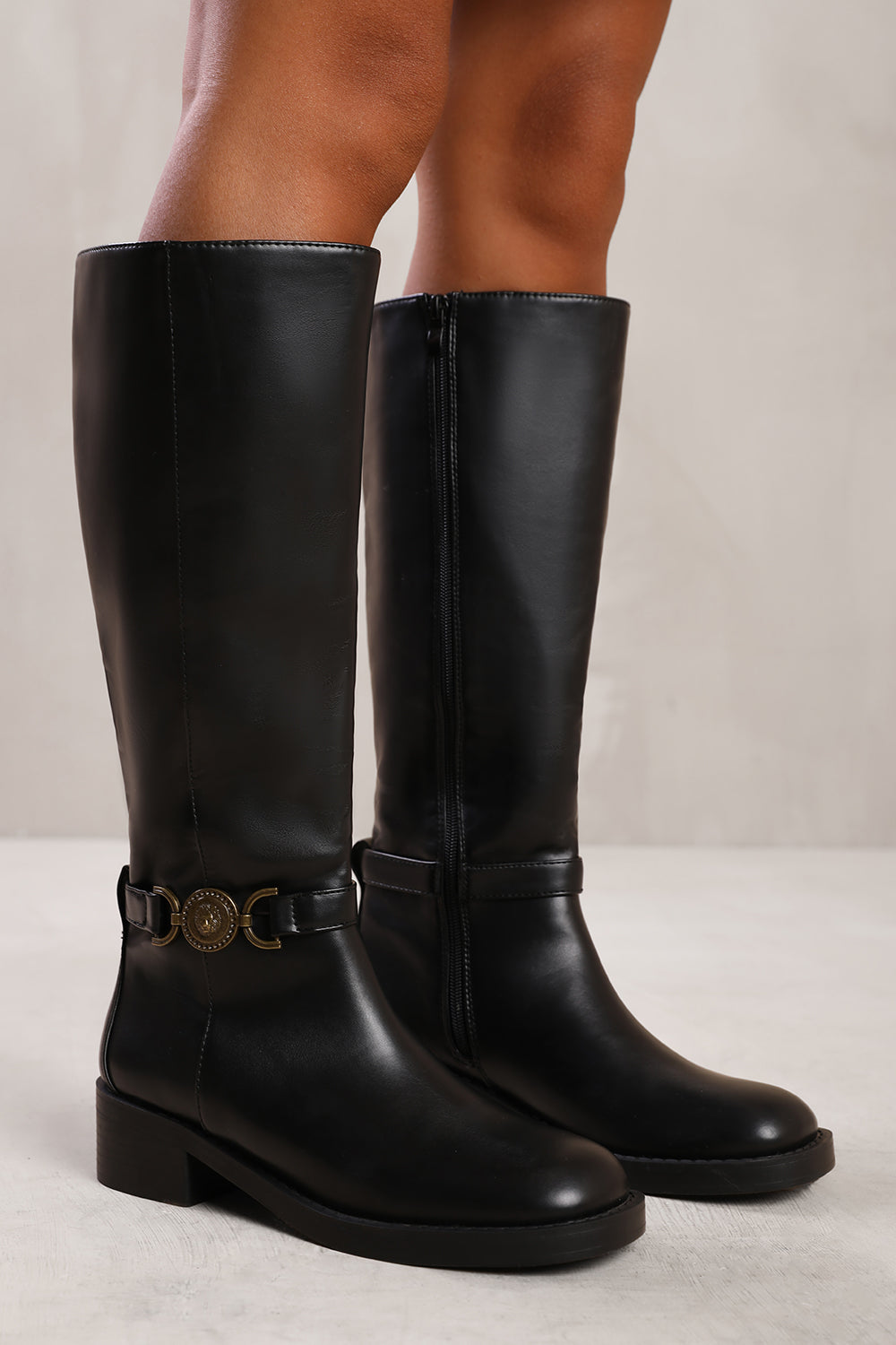 WASHINGTON BELOW KNEE BOOT WITH GOLD BUCKLE DETAIL IN BLACK FAUX LEATHER