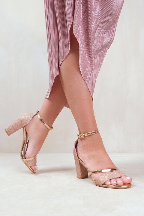 PERLA MID HIGH BLOCK HEEL SANDALS WITH ANKLE STRAP IN ROSE GOLD GLITTER