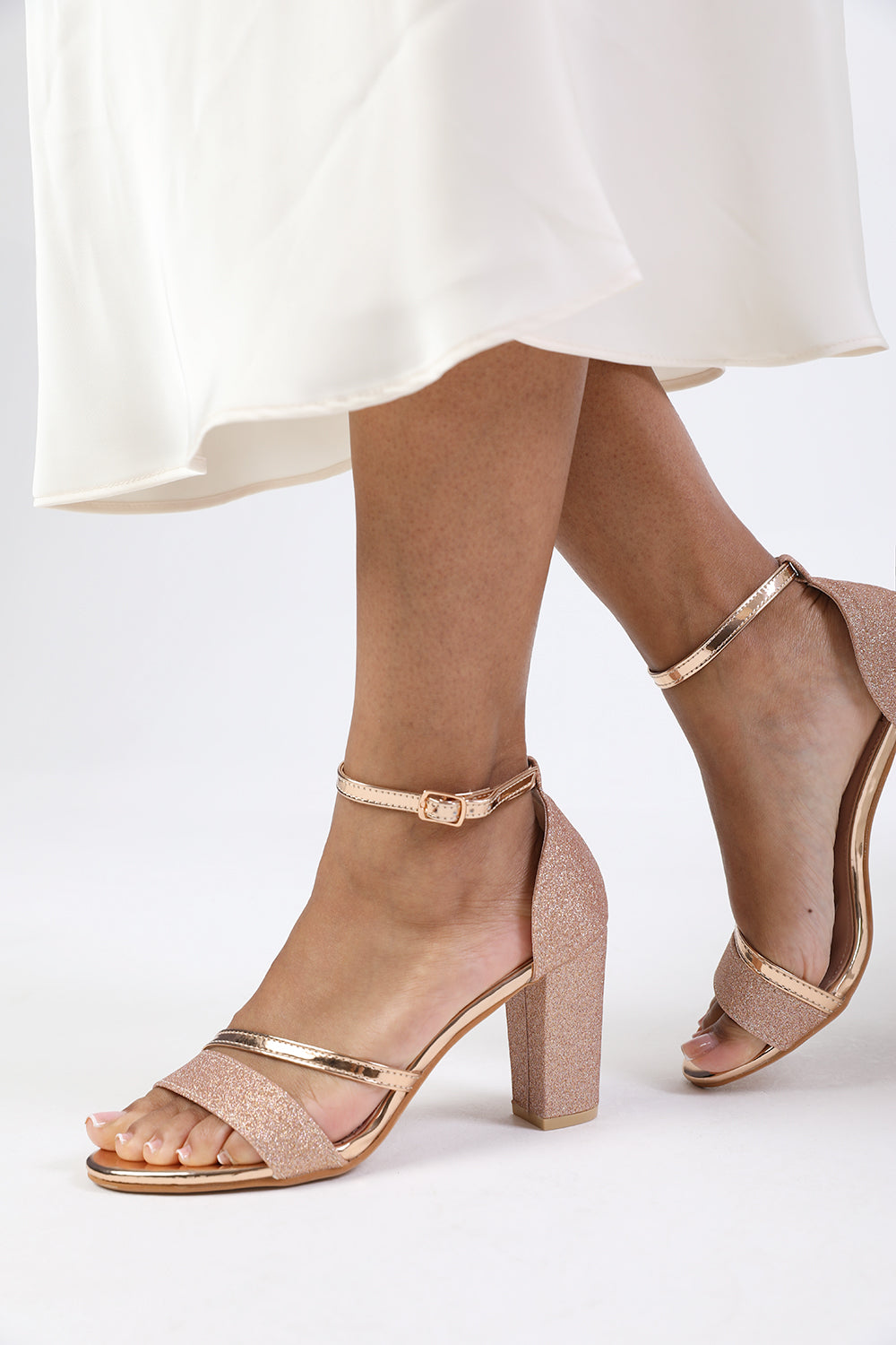 PERLA MID HIGH BLOCK HEEL SANDALS WITH ANKLE STRAP IN ROSE GOLD GLITTER