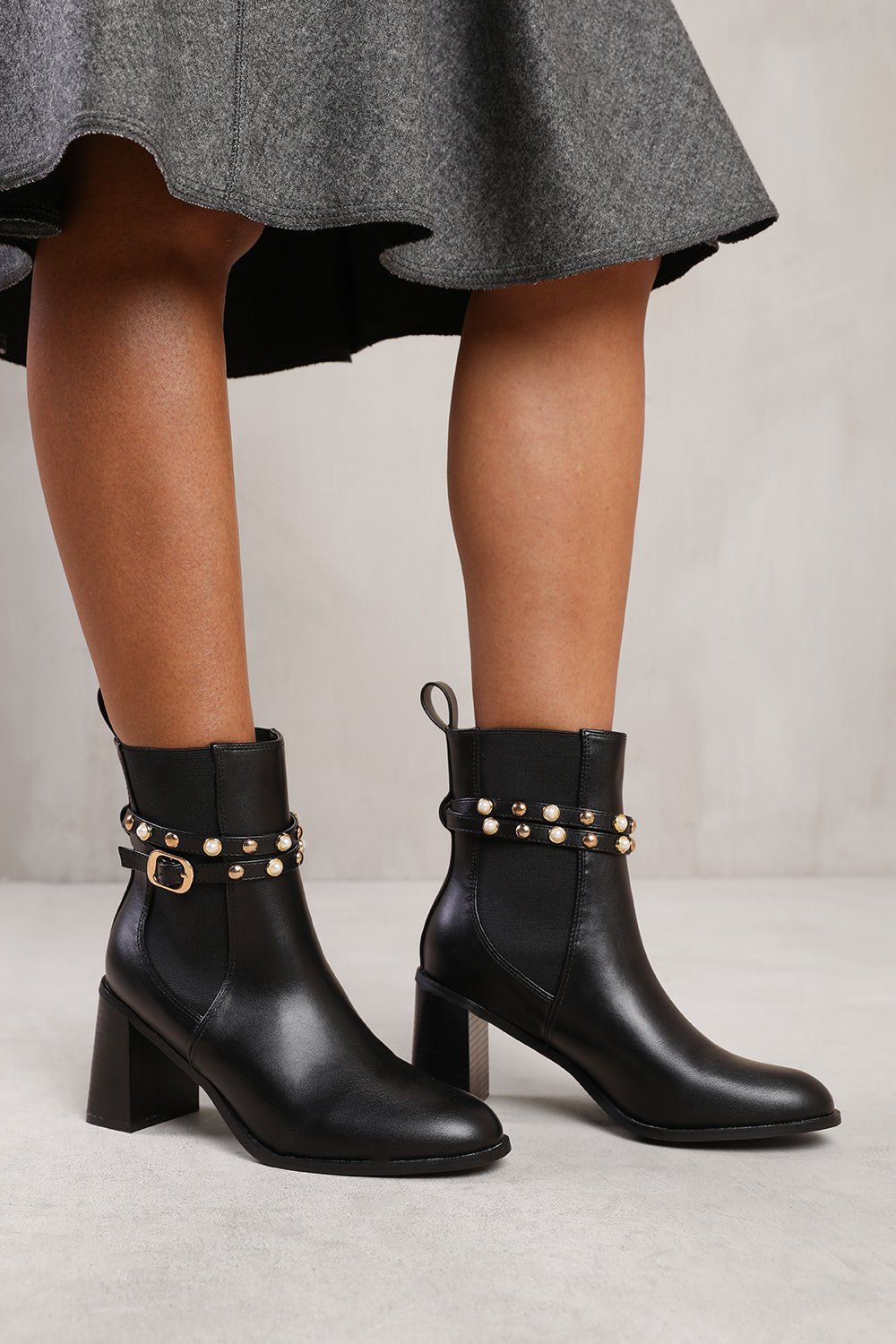 JAYLA ANKLE BOOT WITH PEARL AND STUD DETAILING IN BLACK FAUX LEATHER