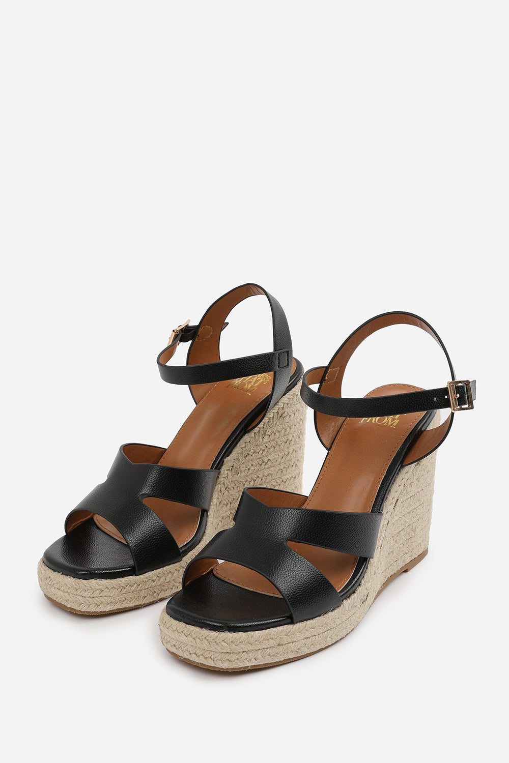 SANSA CUT OUT STRAP DETAIL WEDGE SHOES WITH BUCKLE CLOSURE IN BLACK GRAIN PU