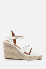 SANSA WIDE FIT CUT OUT STRAP DETAIL WEDGE SHOES WITH BUCKLE CLOSURE IN WHITE GRAIN PU