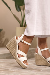 SANSA WIDE FIT CUT OUT STRAP DETAIL WEDGE SHOES WITH BUCKLE CLOSURE IN WHITE GRAIN PU