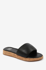 JULIA WIDE FIT FLATFORM SLIDERS SANDAL IN BLACK FAUX LEATHER
