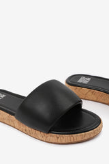 JULIA WIDE FIT FLATFORM SLIDERS SANDAL IN BLACK FAUX LEATHER