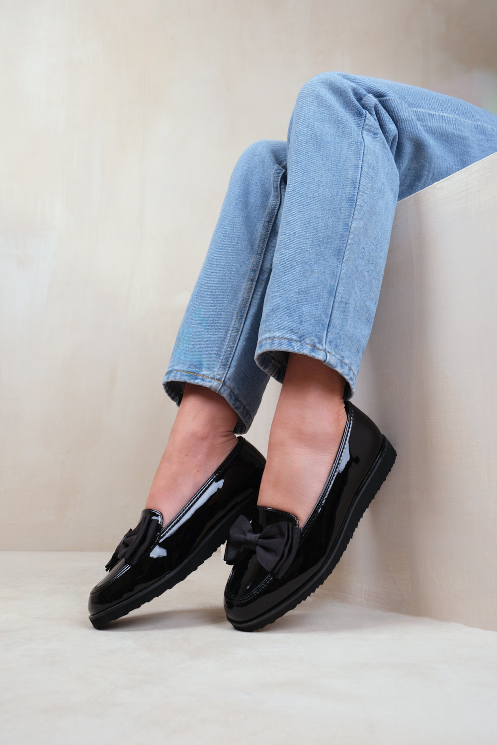 ALPHA WIDE FIT SLIP ON LOAFER SLIDER WITH BOW DETAIL IN BLACK PATENT FAUX LEATHER