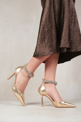 SAPPHIRE POINTED TOE HIGH HEELS WITH DIAMANTE DETAIL ANKLE STRAP IN GOLD METALLIC