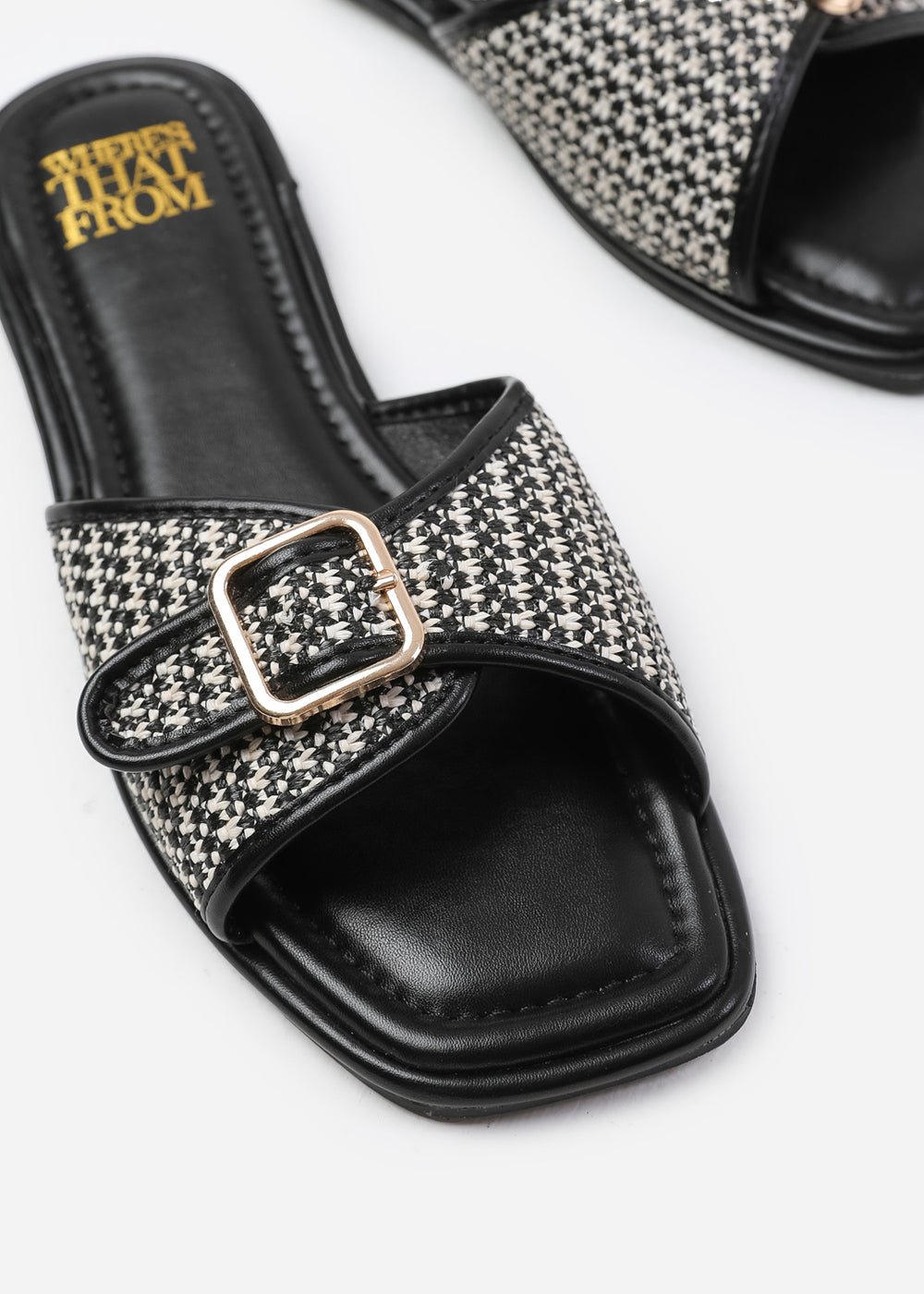 VERMONT FRONT BUCKLE RAFFIA SLIDERS IN BLACK FAUX LEATHER