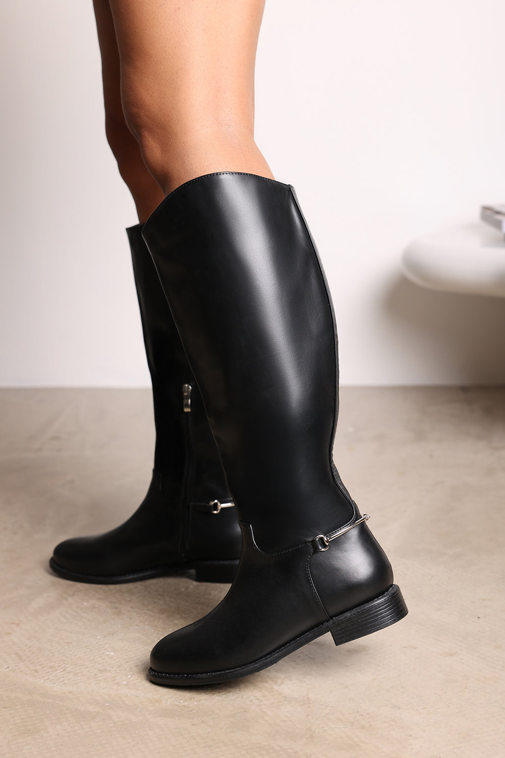 Monroe Black Knee High Boots with Low Flat Heel and Back Buckle Detail
