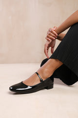 MINSK WIDE FIT LOW HEEL WITH STRAP AND BUCKLE DETAIL IN BLACK PATENT