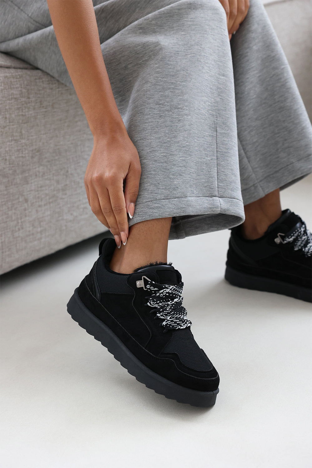 Lumina Black Suede Low Top Trainer with mesh panel and Faux fur lining