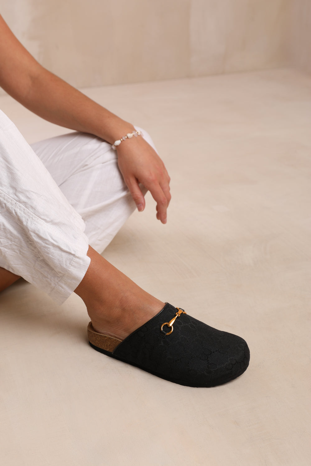 DUBLIN OPEN BACK SLIP ON LOAFER WITH GOLD DETAIL IN BLACK