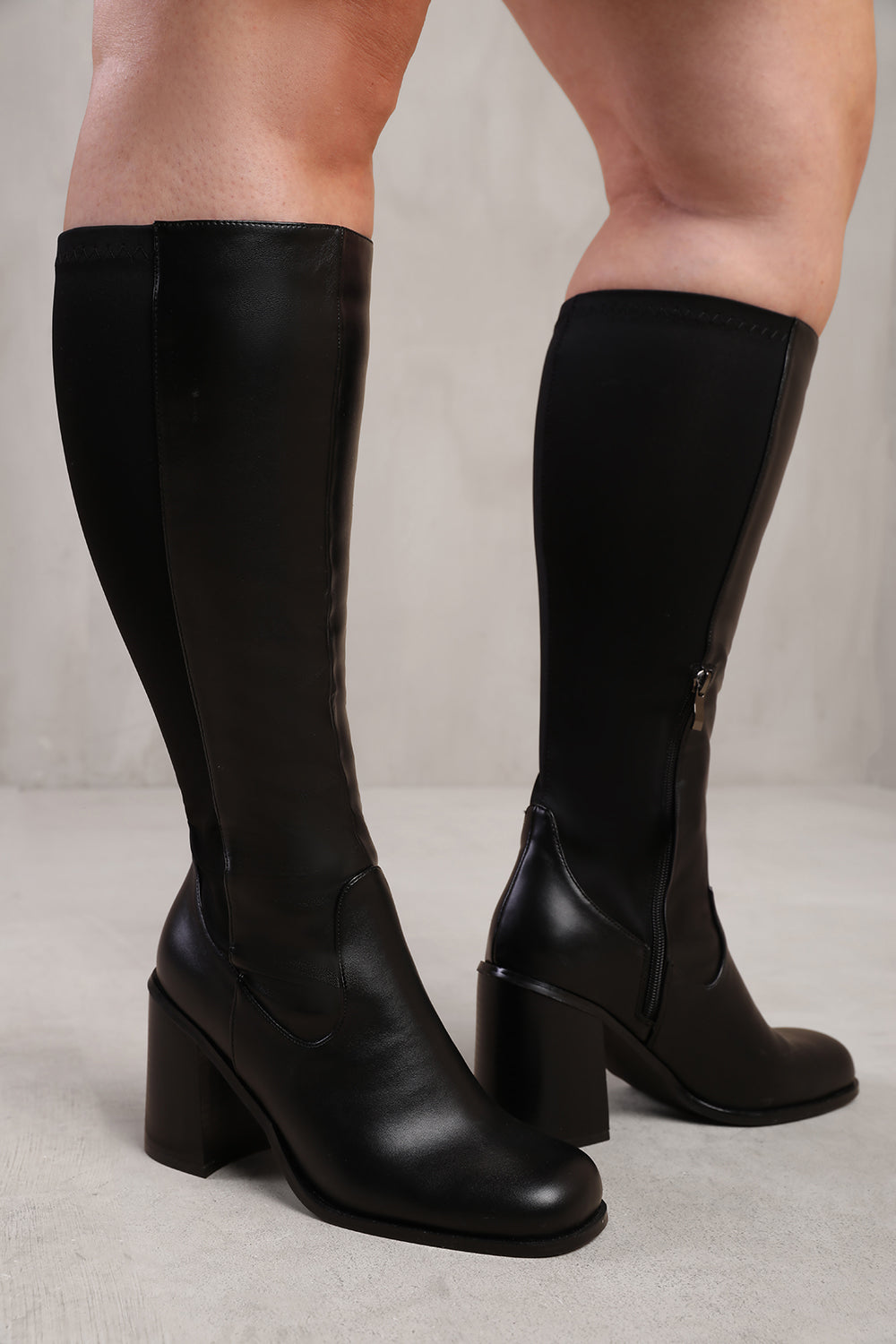 ZHURI STRETCH WIDE CALF BLOCK HEEL KNEE HIGH BOOTS IN WIDE E FIT IN BLACK FAUX LEATHER