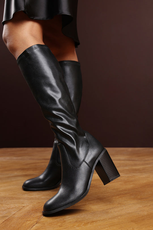 Farah Knee High Block Heel Boots in Stretch Black Faux Leather