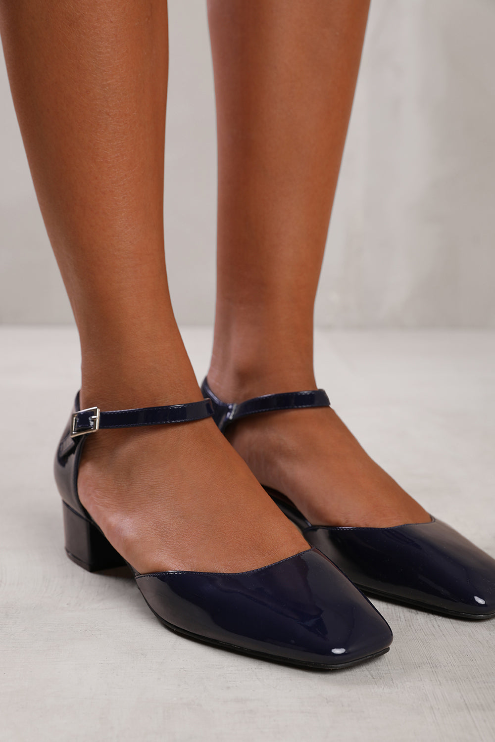 SINGAPORE SQUARE TOE LOW BLOCK HEEL WITH STRAP IN NAVY PATENT