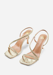 IOWA CRYSTAL CROSS FOOT STRAP MID HEELS IN GOLD METALLIC