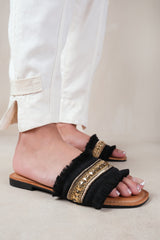 ASTROID FLAT SANDALS WITH FRINGE TRIM AND STUD DETAILS IN BLACK