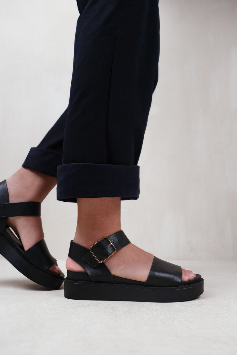 PHOENIX WIDE FIT CLASSIC FLAT SANDALS WITH STRAP AND BUCKLE DETAIL IN BLACK FAUX LEATHER