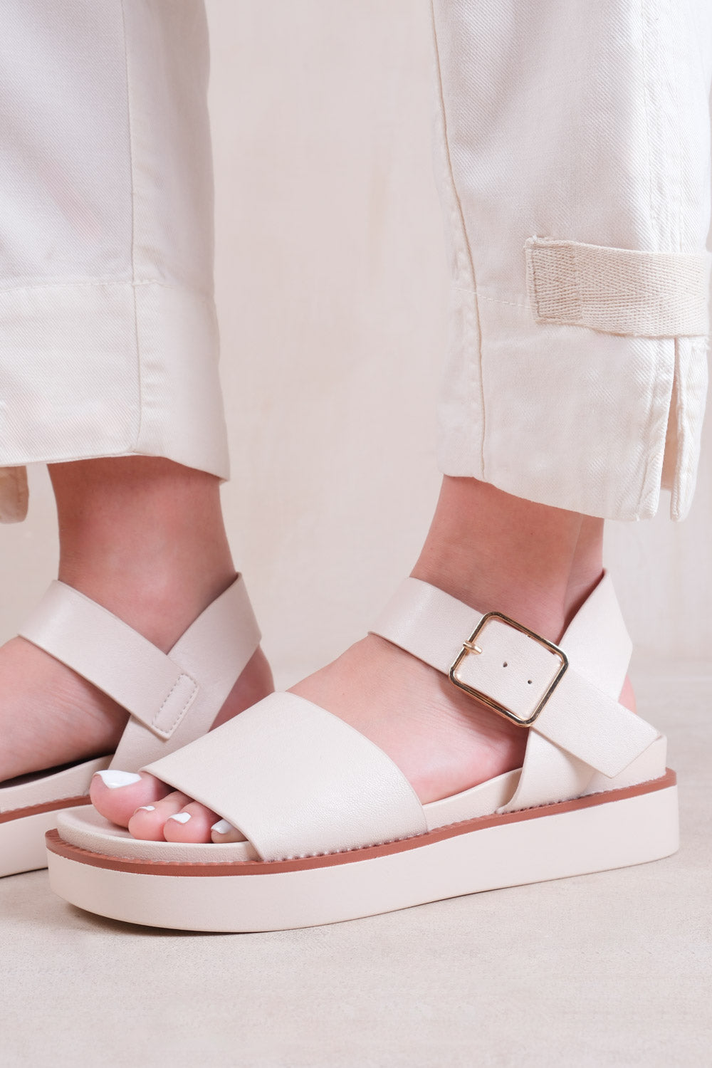 PHOENIX CLASSIC FLAT SANDALS WITH STRAP AND BUCKLE DETAIL IN CREAM FAUX LEATHER