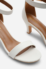 MADRID MID BLOCK HEEL WITH ANKLE STRAP IN WHITE PU