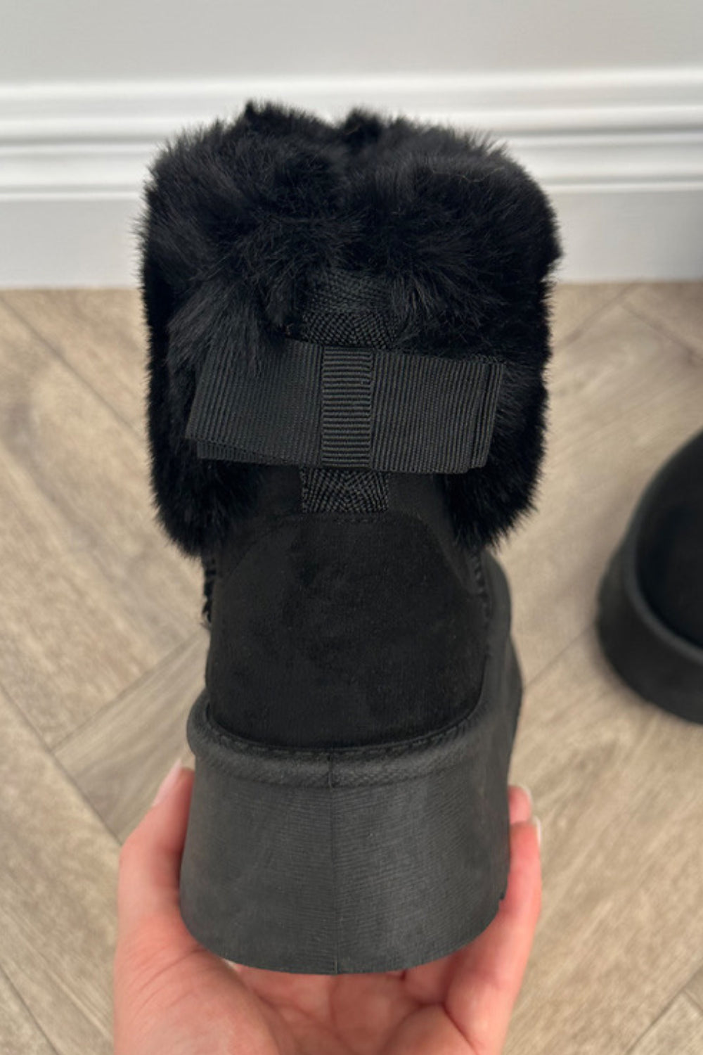 GLORIA SLIP ON ANKLE BOOTS WITH FAUX FUR AND BOW DETAIL IN BLACK SUEDE