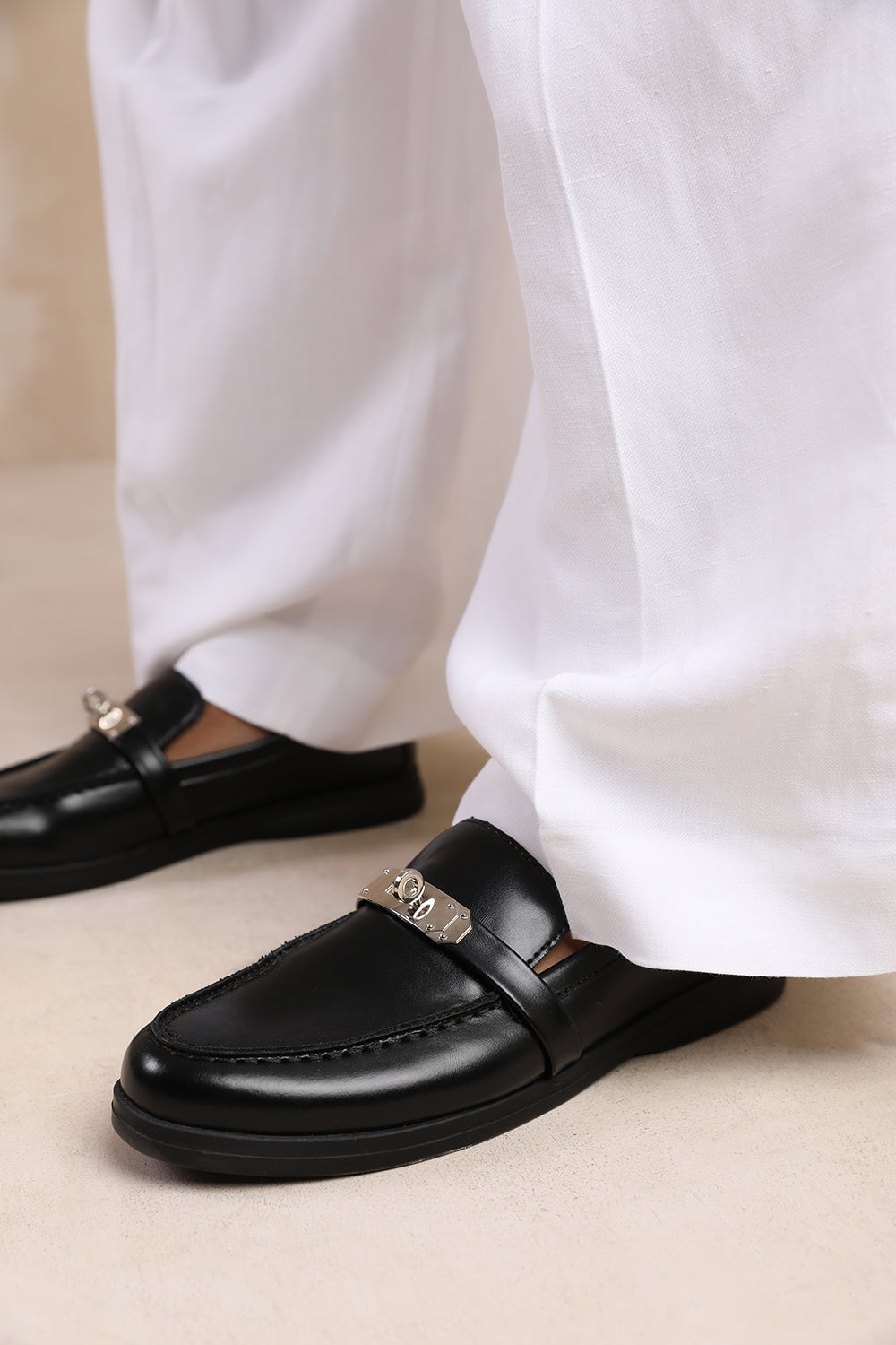 MONACO SLIP ON LOAFERS WITH METAL DETAILING IN BLACK FAUX LEATHER