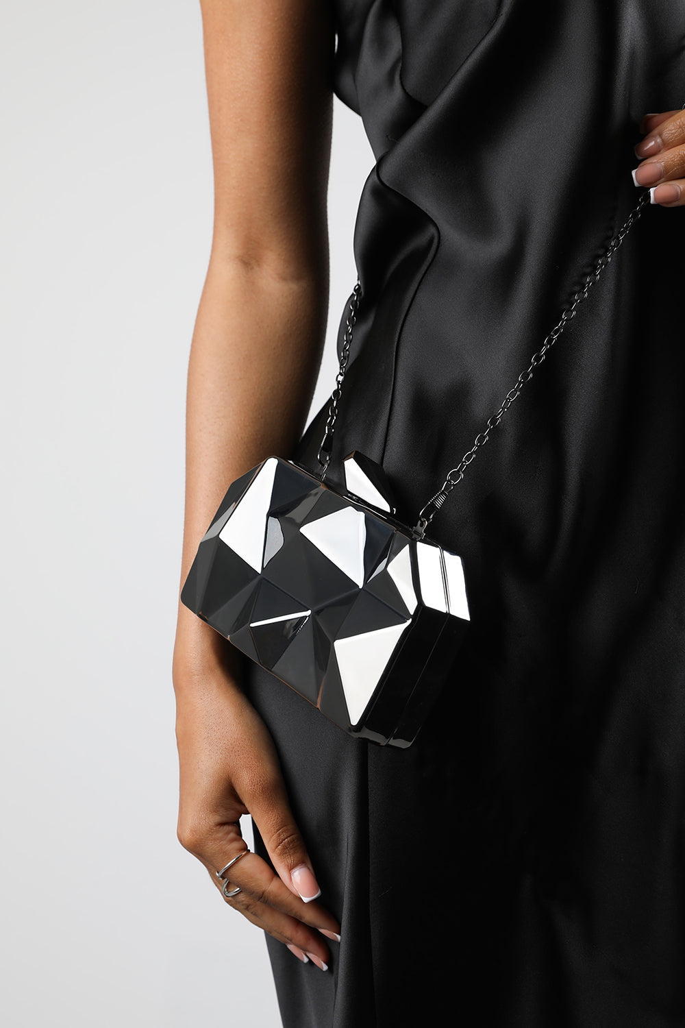 Rica Geometric Clutch Bag In Black