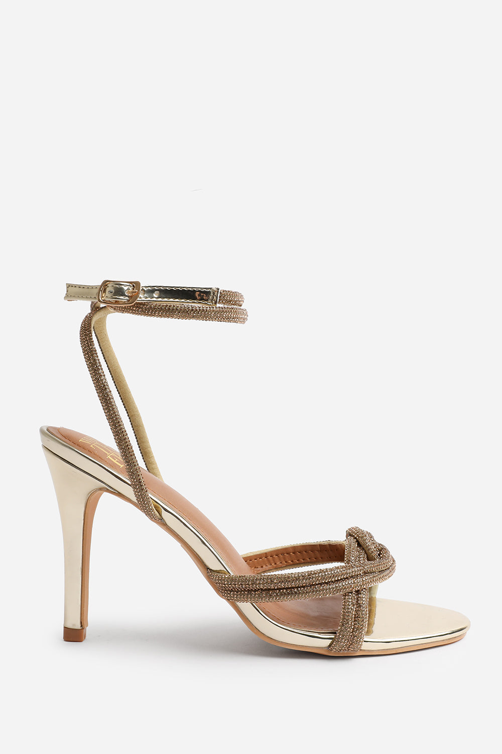 MADON WIDE FIT DIAMANTE KNOT DETAIL WITH CROSS OVER ANKLE STRAP HIGH HEELS IN GOLD CHROME