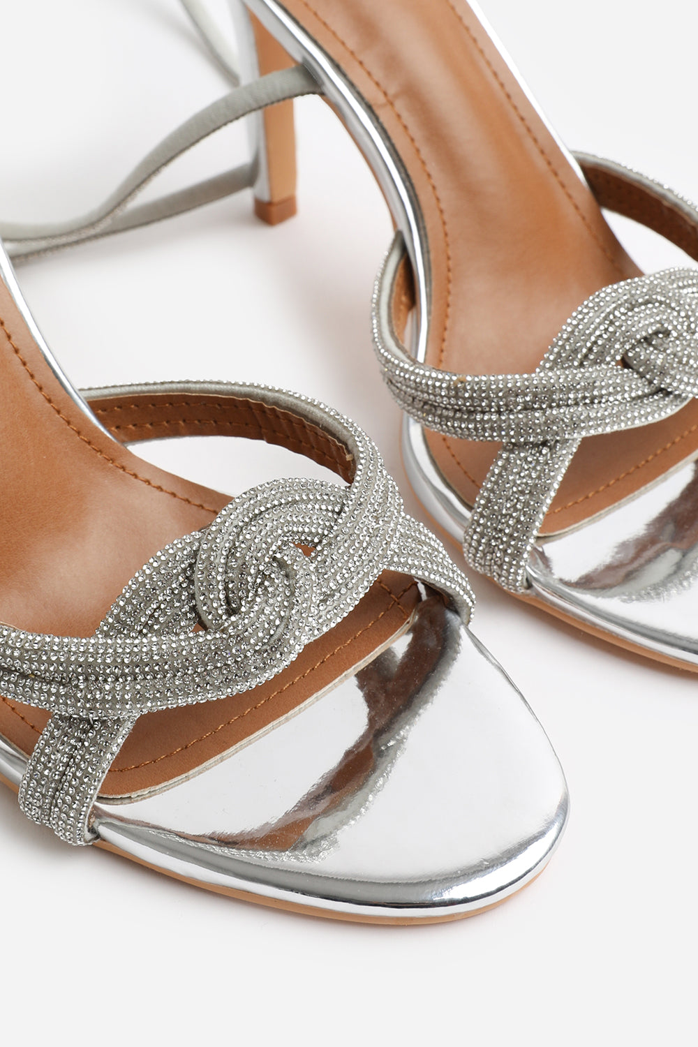 MADON DIAMANTE KNOT DETAIL WITH CROSS OVER ANKLE STRAP HIGH HEELS IN SILVER CHROME